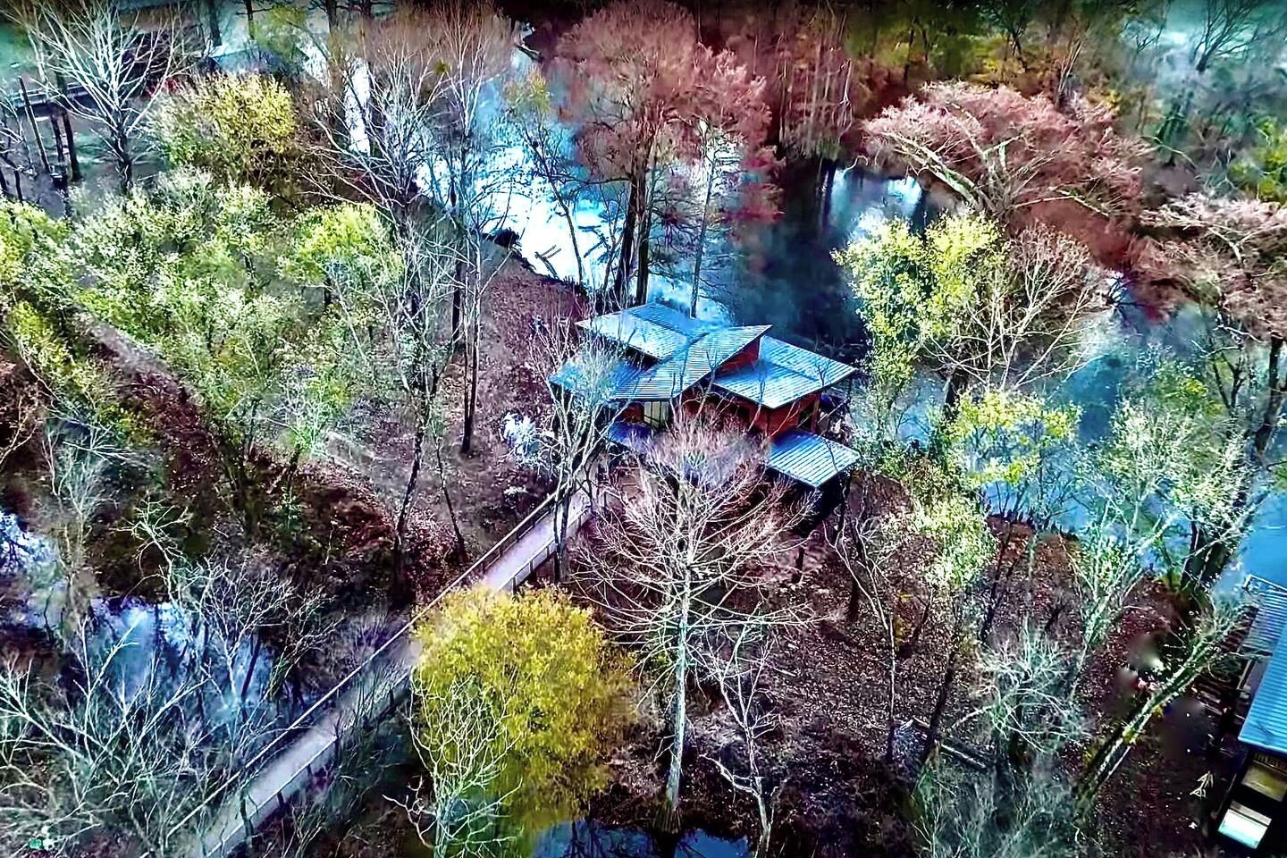 Several times a year, the river rises and this entire cabin is actually over the Mountain Fork River, creating an amazingly unique Bora-Bora meets Treehouse Masters experience 