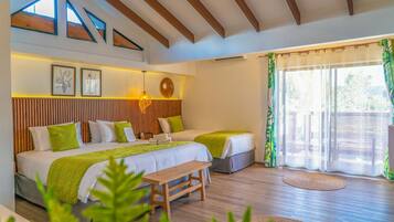 A bedroom with two beds, a wooden bench, a large window with curtains, and a ceiling with wooden beams.