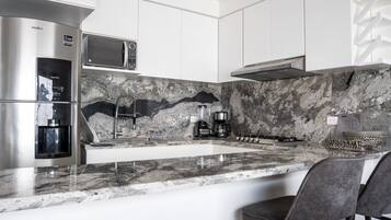 Fridge, microwave, stovetop, coffee/tea maker