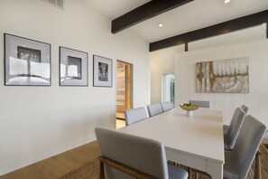 Enjoy meals in this stylish dining area with a long table and six comfortable chairs.