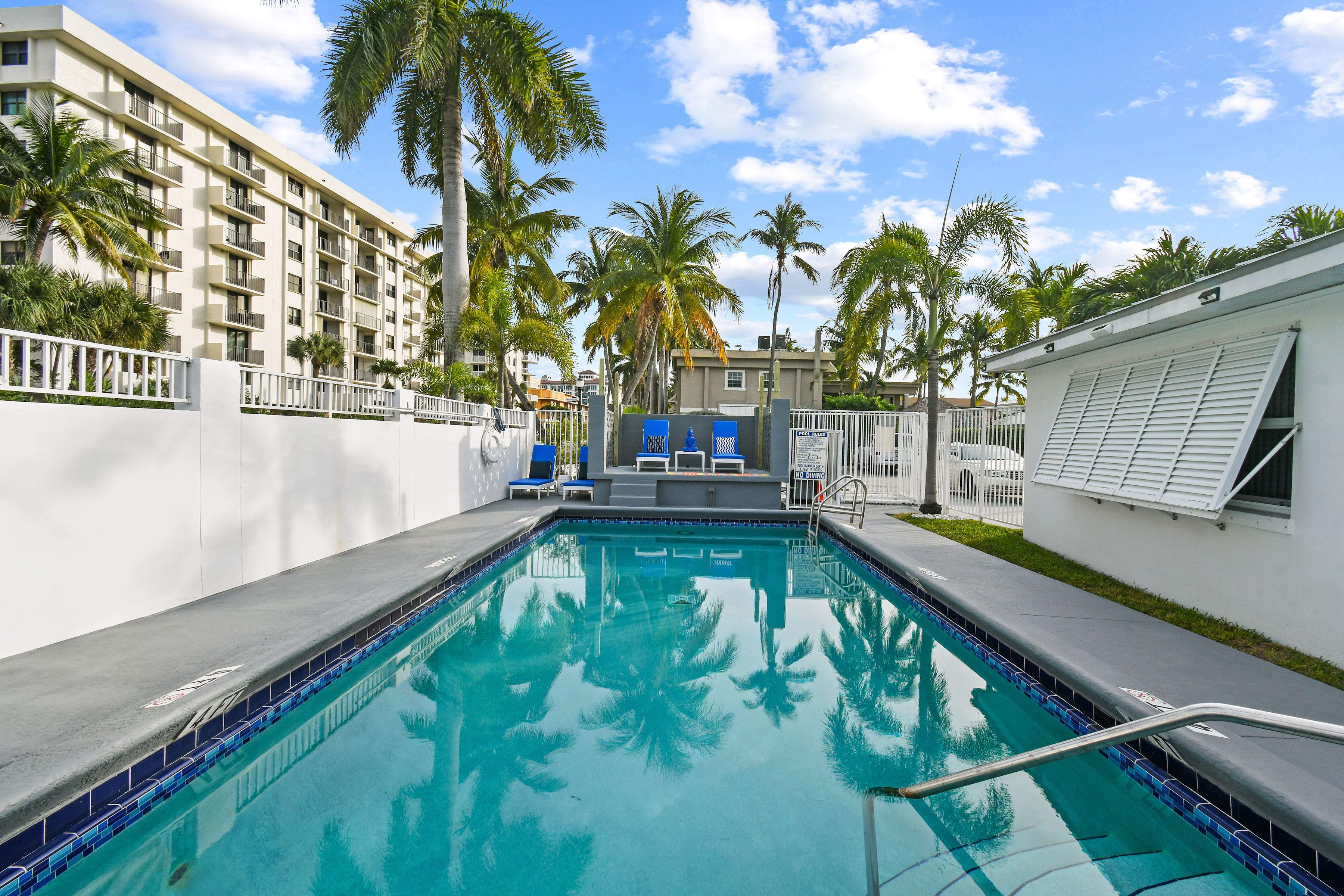 Outdoor pool, open 7:00 AM to 8:00 PM, pool umbrellas, pool loungers