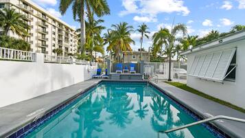 Outdoor pool, open 7:00 AM to 8:00 PM, pool umbrellas, pool loungers