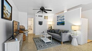 Apartment B | Living area | 35-inch flat-screen TV with cable channels, DVD player