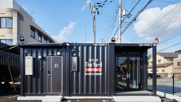 A compact hotel structure with a front desk, labeled "The Yard" and part of the R9 Hotels Group. - HOTEL R9 The Yard Nagahama (Nagahama)