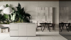 A modern reception area with a central island, seating arrangement, and decorative wall panels. - Green Flow Villa 2 (Ubud)