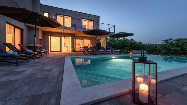A modern house with a swimming pool, outdoor seating, and a lantern. - Amazing home in Visnjan (Visnjan)
