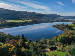 A lake surrounded by hills and trees.