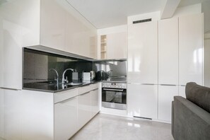 Fridge, microwave, oven, stovetop - Stellar Enge 2BR w/ Private W/D & Storage, nr Groceries, by Blueground (Zurich)