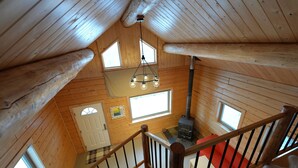 A wooden cabin with a loft bedroom, a fireplace, and a staircase. - View! View! View! Relax in Nature!  (Fairbanks)