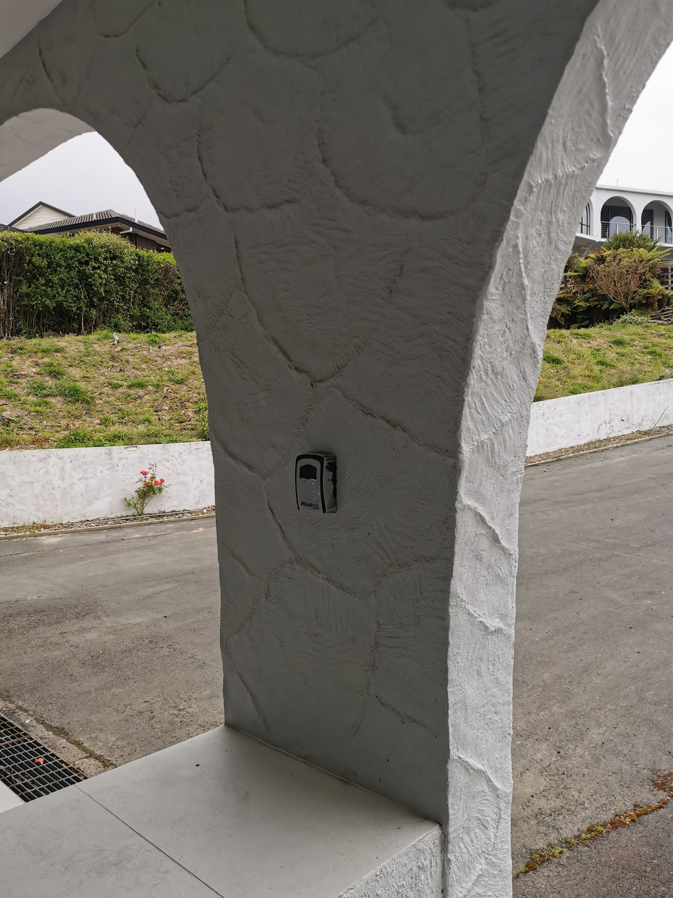 A concrete structure with a utility box labeled "Mastga" on a flat surface.