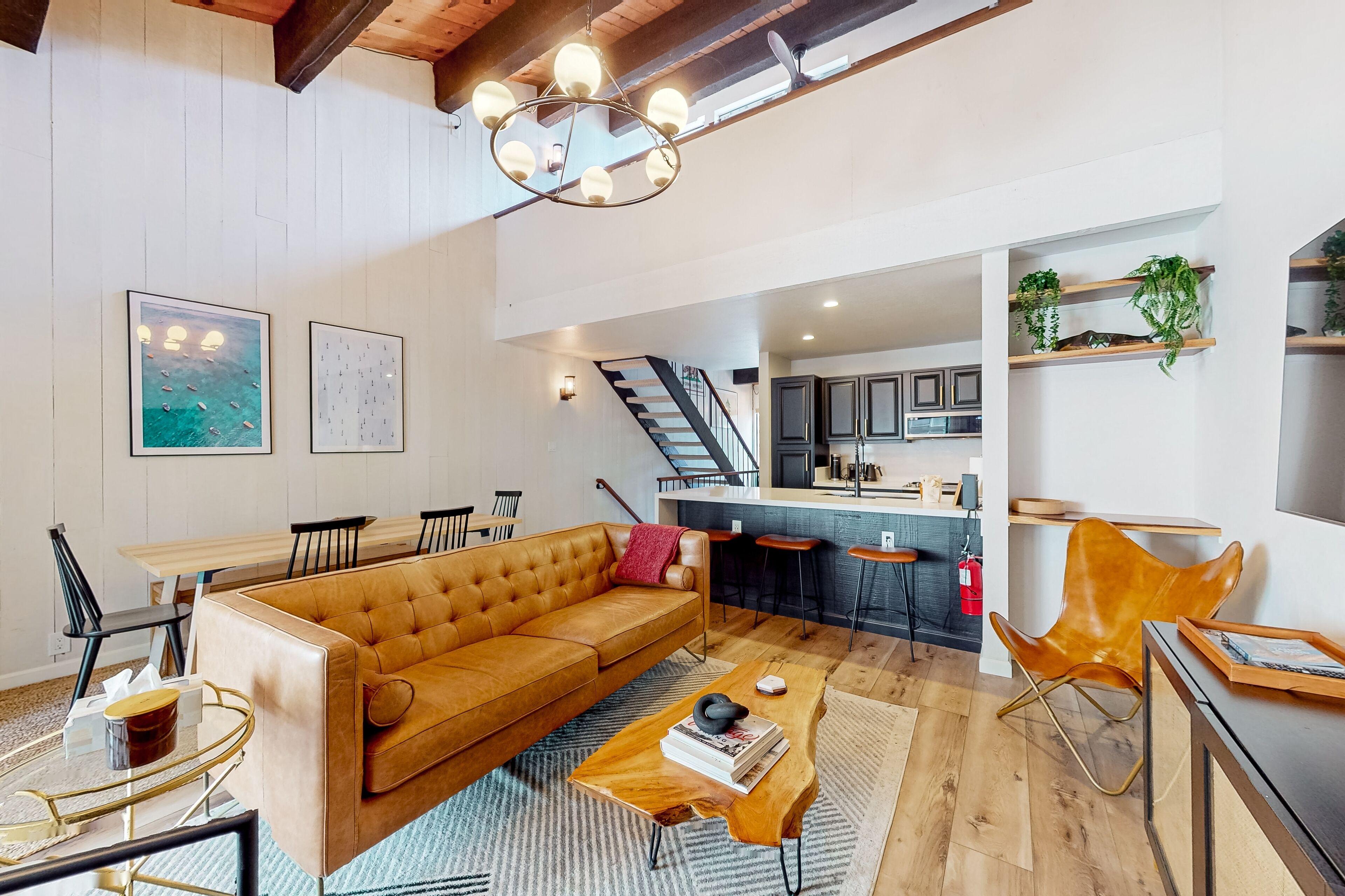 Modern wilderness condo with open layout, shared amenities, balcony, & W/D