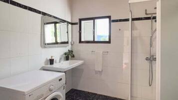 Shower, hair dryer, towels, soap
