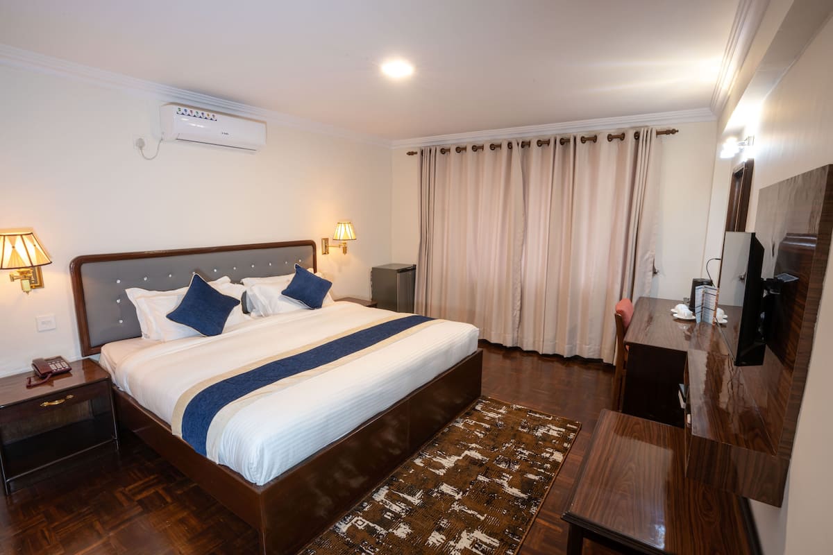1 habitación, minibar, escritorio y espacio para trabajar con laptop
