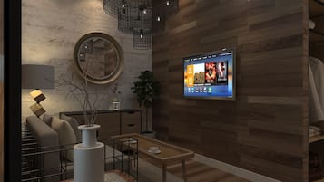 프리미어 스위트 | 거실 공간 | 디지털 채널 시청이 가능한 46인치 평면 TV, 유료 영화, 스마트 스피커