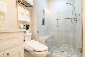 Shower, hair dryer, towels, soap