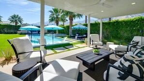 A covered outdoor area with a pool, seating, and a view of mountains. - Mtn Views + Outdoor Oasis: Palm Springs Home! (Palm Springs)