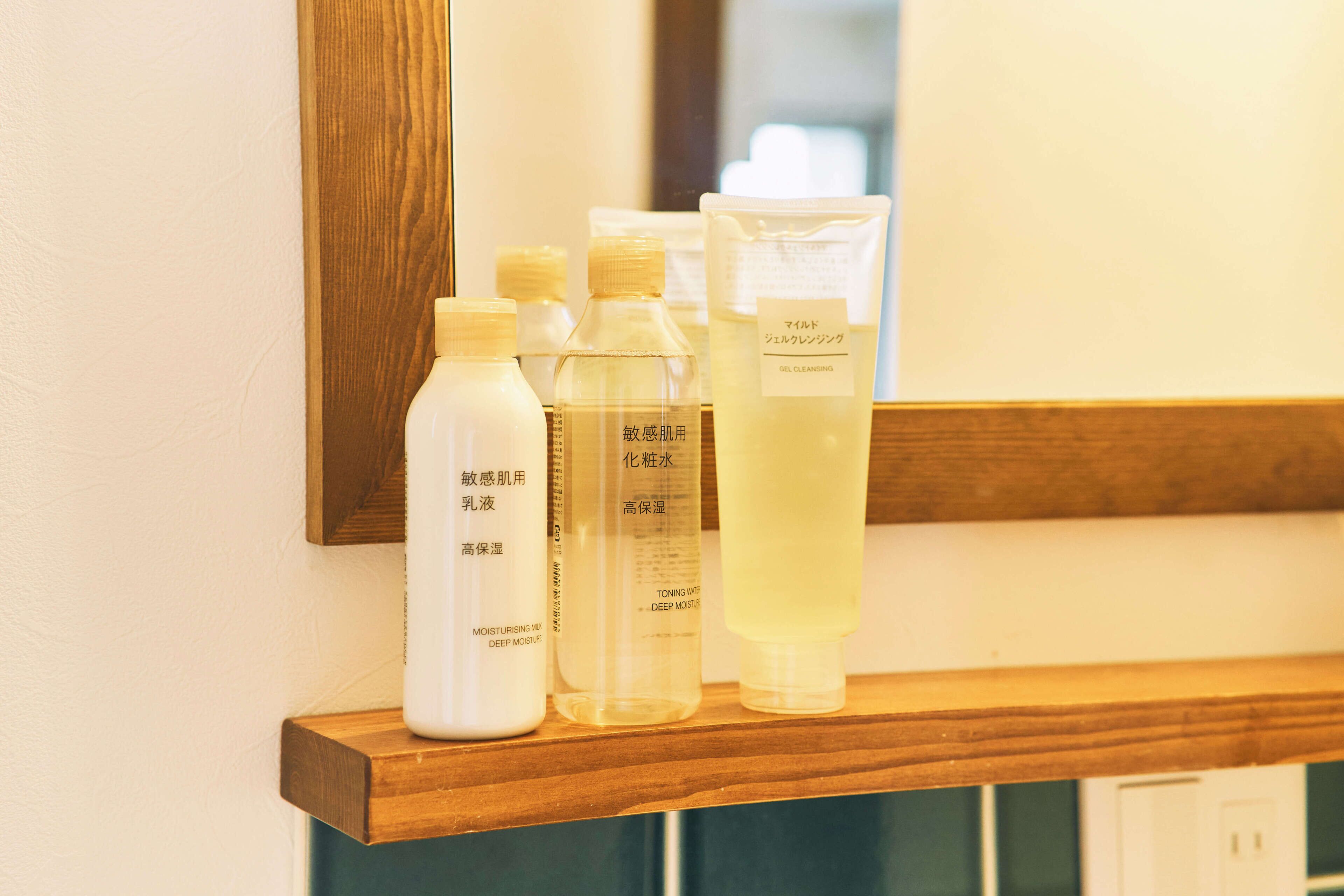 A shelf with various skincare products.