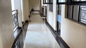 A corridor with a sign indicating a gym. - Ruaka view (Ruaka)