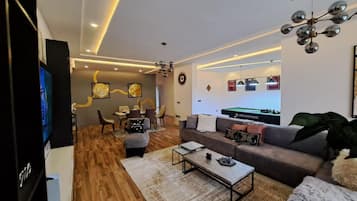 Apartamento | Área de estar | TV