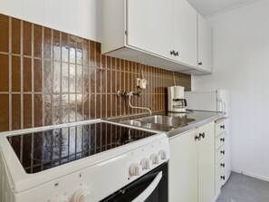 Fridge, oven, high chair, cookware/dishes/utensils