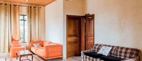 Apartamento luxo, 1 quarto | Área de estar