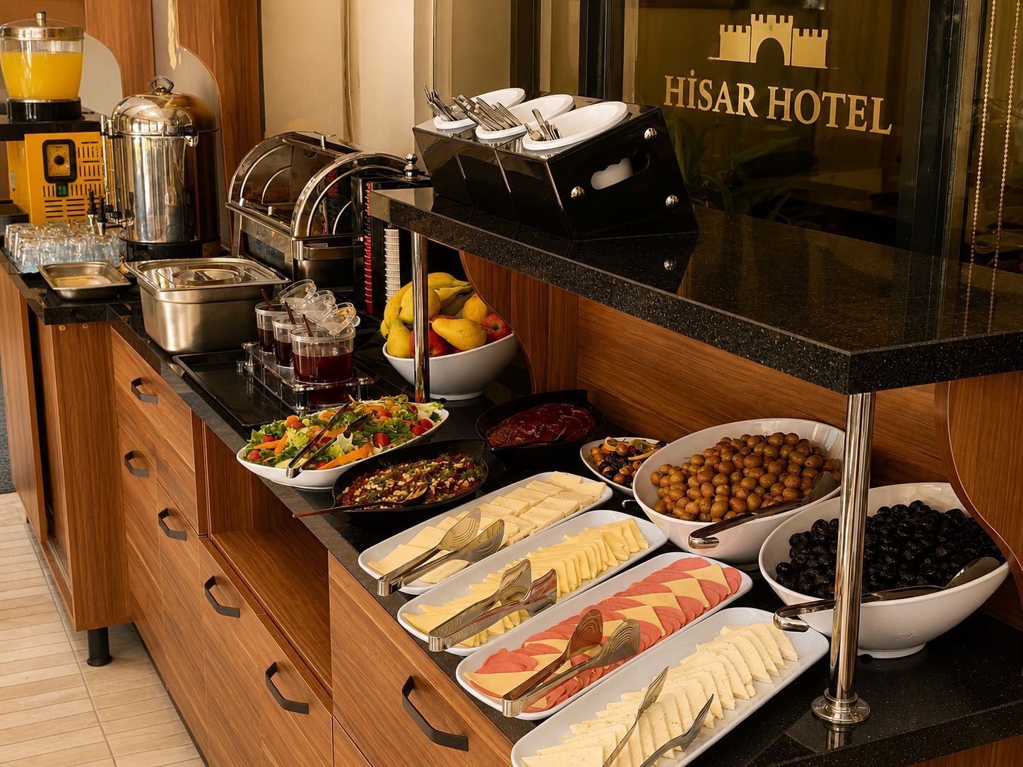 A buffet setup with various food items, a coffee machine, and a fruit bowl.