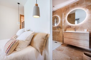 Shower, hair dryer, towels, toilet paper