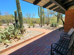 A patio area with a brick pathway, cacti, and a bench. - The Duke - Iconic Foothills Escape with Pool &Spa (Tucson)