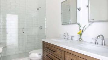 Shower, hair dryer, towels, shampoo