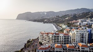 Stunning beachfront views of a vibrant coastal city with a mix of architectural styles.