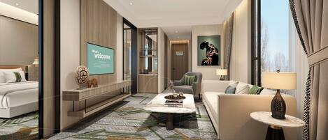 Una habitación de hotel moderna con una cama grande, un sofá, una mesa de centro y un televisor que muestra el texto 'What a welcome'.