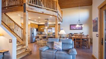 Smart TV, fireplace, books, computer monitors