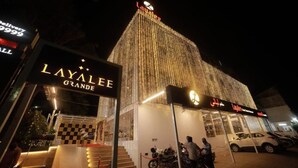 A building with a sign reading "LAYALEE GRANDE" and a large illuminated sign at the top. - Hotel Layalee Grande Chennai (Chennai)