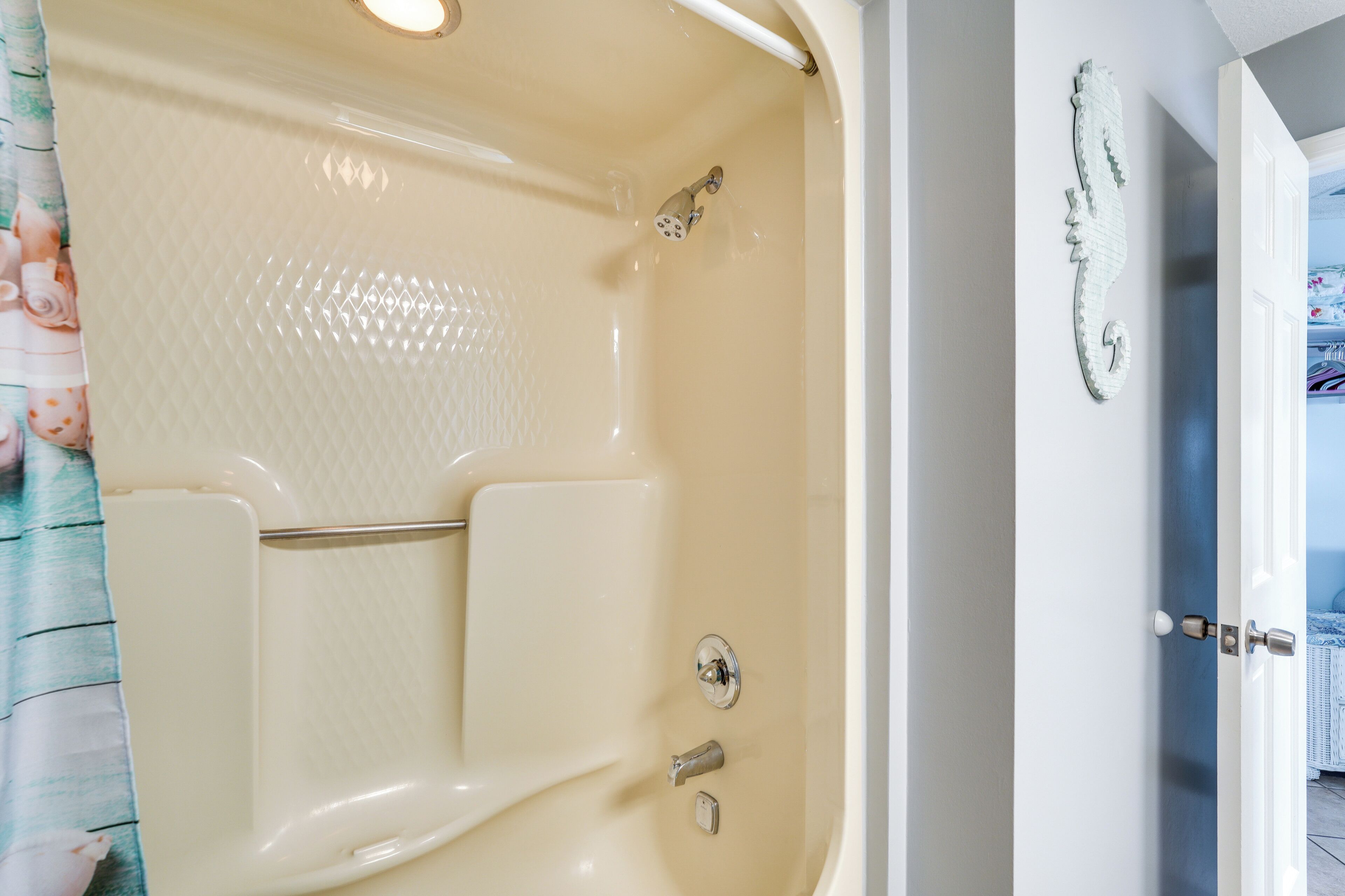 A bathroom with a bathtub, a shower, and a toilet.