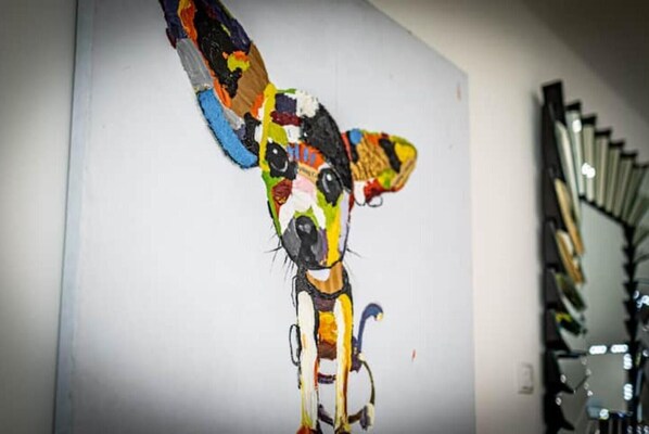 A colorful abstract painting on a wall.