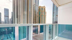 A high-rise residential building with multiple balconies and large windows. - Neat 2 Bed l Media City Park l near Dubai Harbour (Dubai Marina)
