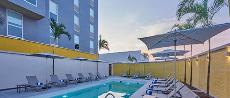 Outdoor pool, free cabanas, pool umbrellas