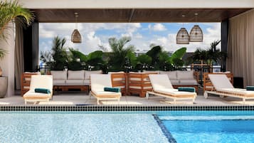 Outdoor pool, open 9:00 AM to 8:00 PM, free cabanas, pool umbrellas