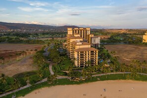 A multi-story hotel with a pool and beach access. - Ko Olina Beach Villas O1404 by Gather: Penthouse Villa w/ Lagoon & Ocean Views (Kapolei)