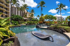 Another pool with a lounger set in the shallows, rock and palms around it. - Ko Olina Beach Villas O1404 by Gather: Penthouse Villa w/ Lagoon & Ocean Views (Kapolei)