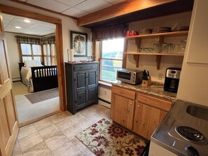 Fridge, microwave, stovetop, coffee/tea maker