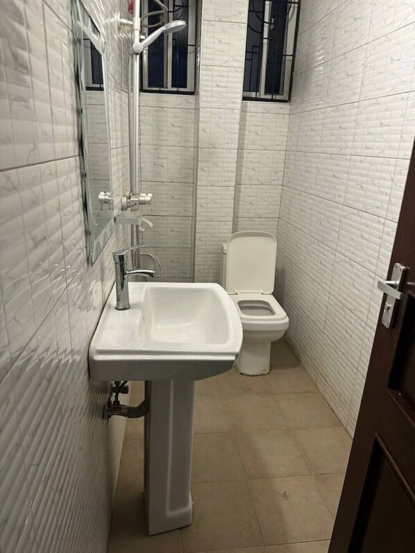 Shower, towels, soap, toilet paper