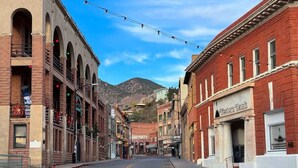 A street with buildings, including a Western Bank bank. - Deluxe Room at The Block (Bisbee)