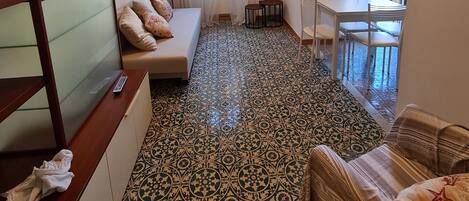 Basic Apartment | Living area | 19-inch flat-screen TV with digital channels