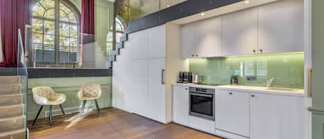 Microwave, coffee/tea maker, dining tables