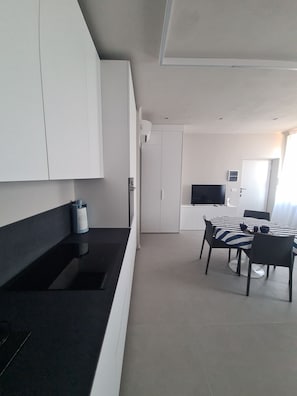 Deluxe Apartment | Private kitchen | Full-size fridge, microwave, espresso maker, coffee/tea maker