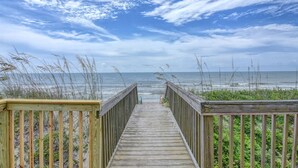 A wooden boardwalk leading to the beach with a view of the ocean and sky. - Oceanfront Queen's Grant Condo "Tide-the-Knot" with Breathtaking Ocean Views! (Topsail Beach)