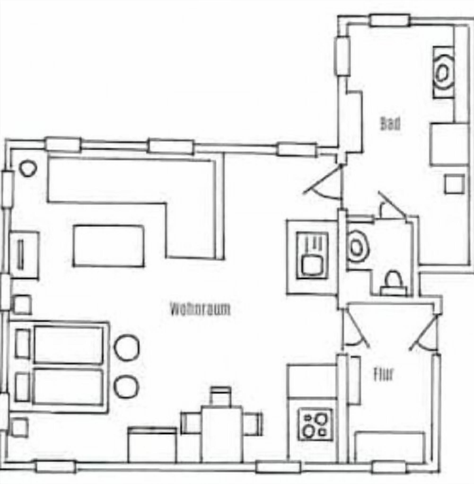 Een plattegrond met een woonkamer, keuken, badkamer en slaapkamer.