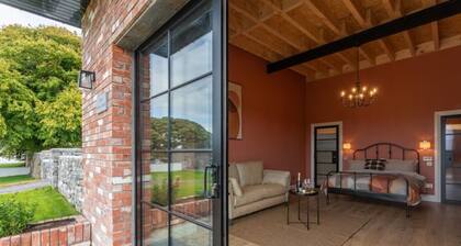 19th century restored Irish stable by the lake