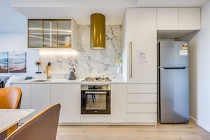 Coffee/tea maker, fridge, microwave, oven